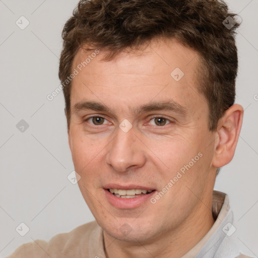 Joyful white adult male with short  brown hair and brown eyes