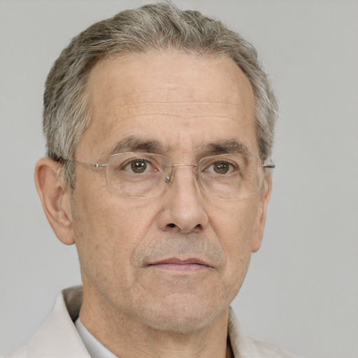 Neutral white middle-aged male with short  gray hair and brown eyes