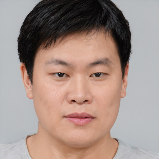 Neutral asian young-adult male with short  brown hair and brown eyes