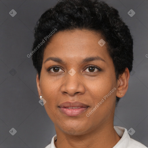 Joyful black adult female with short  black hair and brown eyes