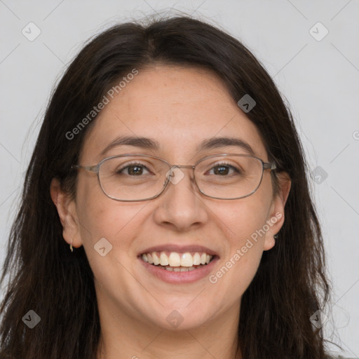 Joyful white adult female with long  brown hair and grey eyes