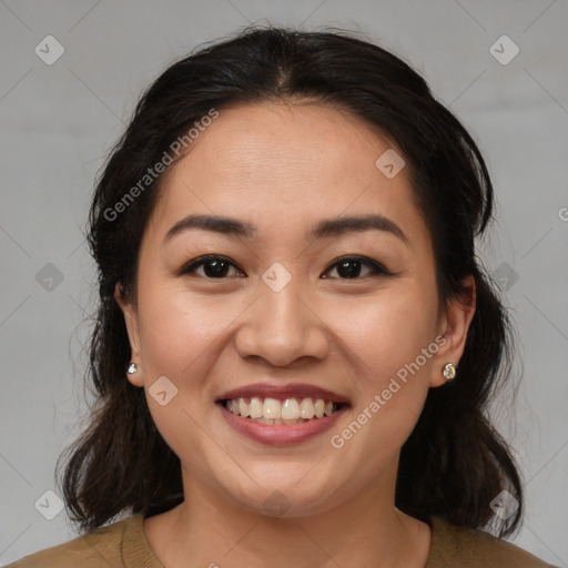 Joyful asian young-adult female with medium  brown hair and brown eyes