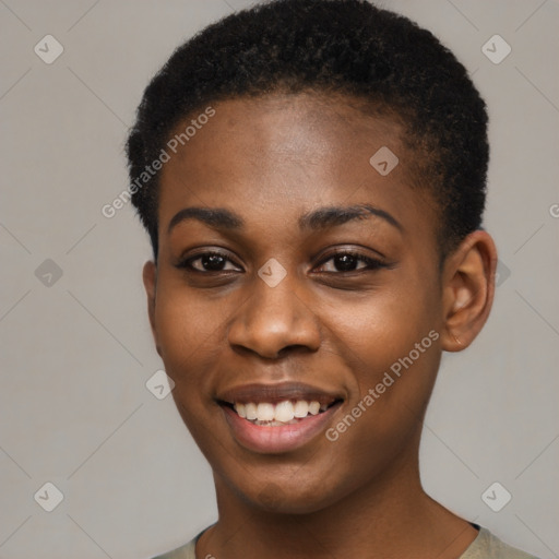 Joyful black young-adult female with short  black hair and brown eyes