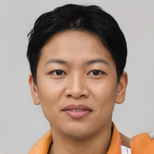 Joyful asian young-adult female with short  black hair and brown eyes