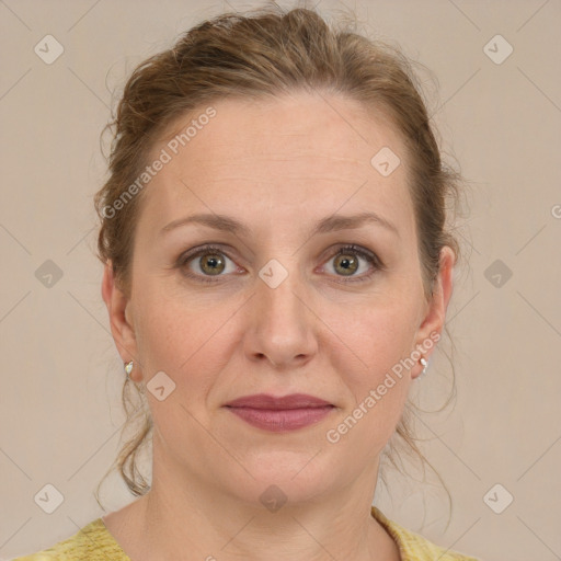 Joyful white adult female with medium  brown hair and blue eyes