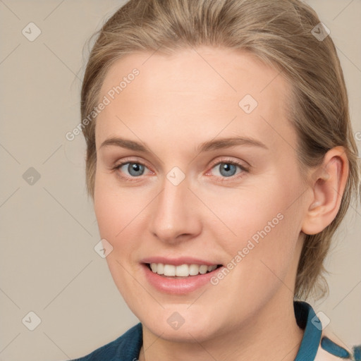 Joyful white young-adult female with medium  brown hair and blue eyes