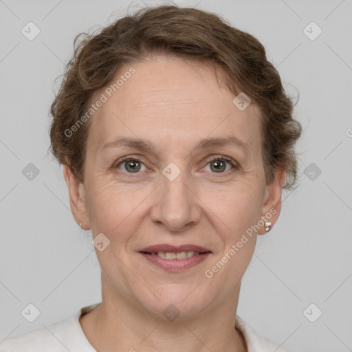 Joyful white adult female with short  brown hair and grey eyes