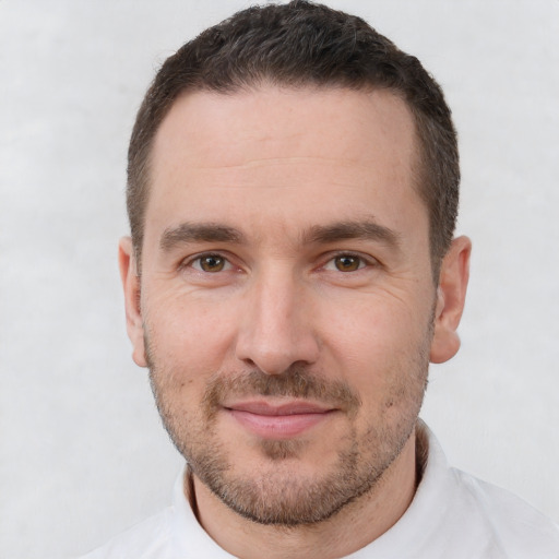 Joyful white adult male with short  brown hair and brown eyes