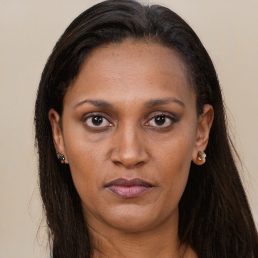 Neutral black young-adult female with long  brown hair and brown eyes