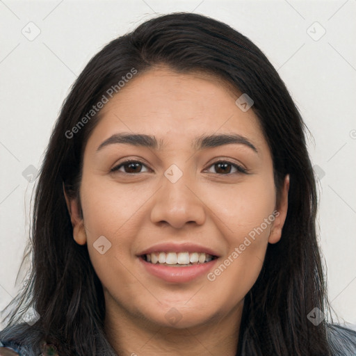 Joyful latino young-adult female with long  brown hair and brown eyes