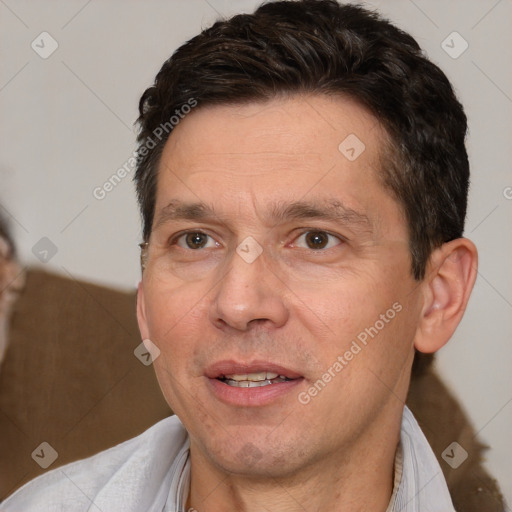 Joyful white adult male with short  brown hair and brown eyes