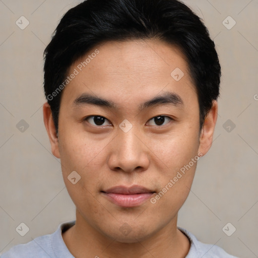 Joyful asian young-adult male with short  black hair and brown eyes