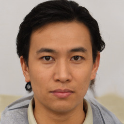 Neutral asian young-adult male with short  brown hair and brown eyes