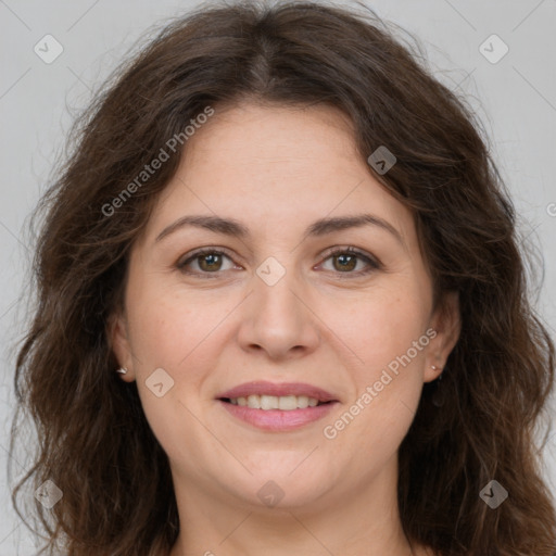 Joyful white adult female with long  brown hair and brown eyes