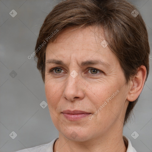 Joyful white adult female with short  brown hair and brown eyes