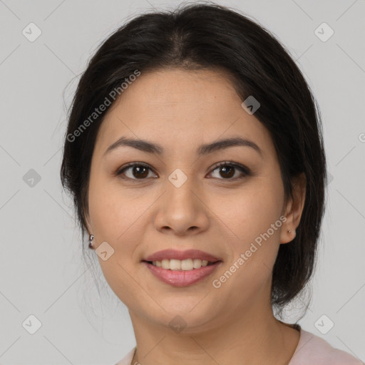 Joyful latino young-adult female with medium  brown hair and brown eyes