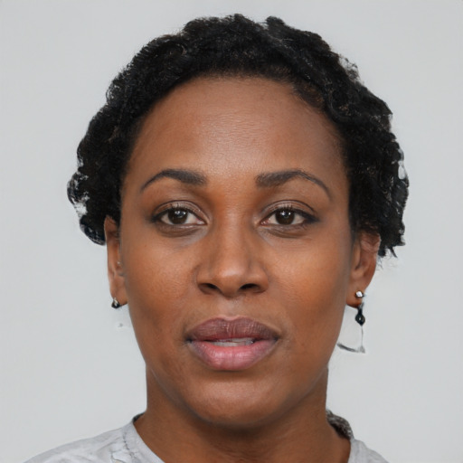 Neutral black adult female with short  black hair and brown eyes