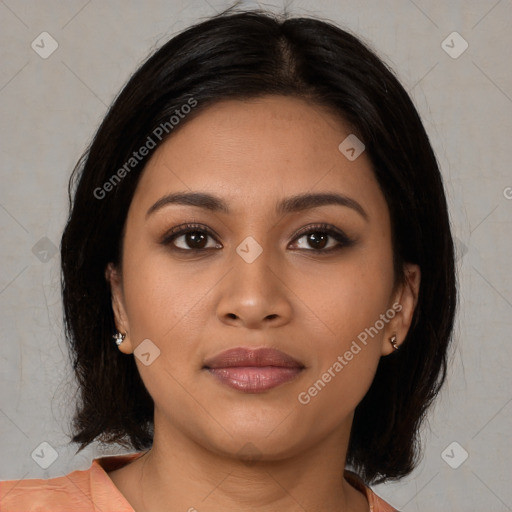 Joyful latino young-adult female with medium  brown hair and brown eyes