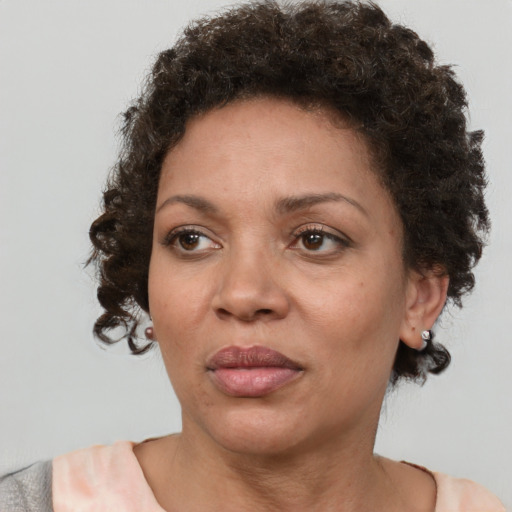 Neutral black adult female with short  brown hair and brown eyes
