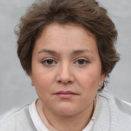 Neutral white young-adult female with short  brown hair and brown eyes