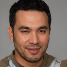 Joyful white young-adult male with short  black hair and brown eyes