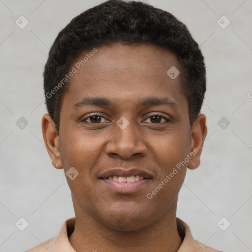 Joyful latino young-adult male with short  brown hair and brown eyes