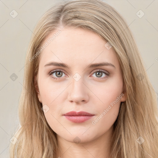 Joyful white young-adult female with long  brown hair and grey eyes