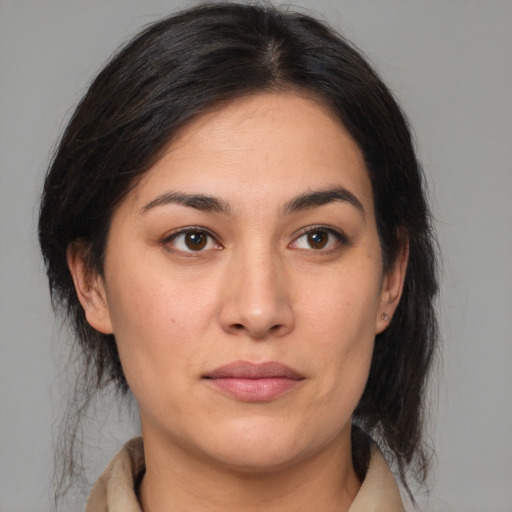 Joyful white young-adult female with medium  brown hair and brown eyes