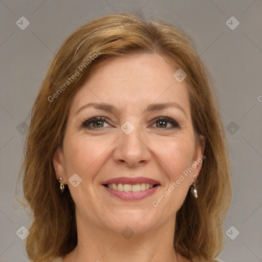 Joyful white adult female with medium  brown hair and brown eyes