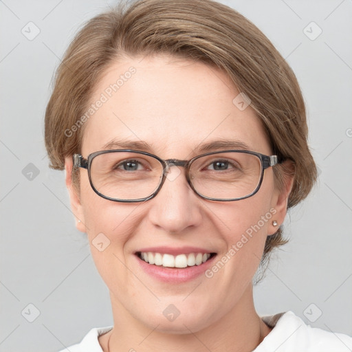 Joyful white adult female with medium  brown hair and blue eyes