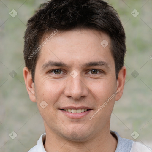 Joyful white young-adult male with short  brown hair and brown eyes