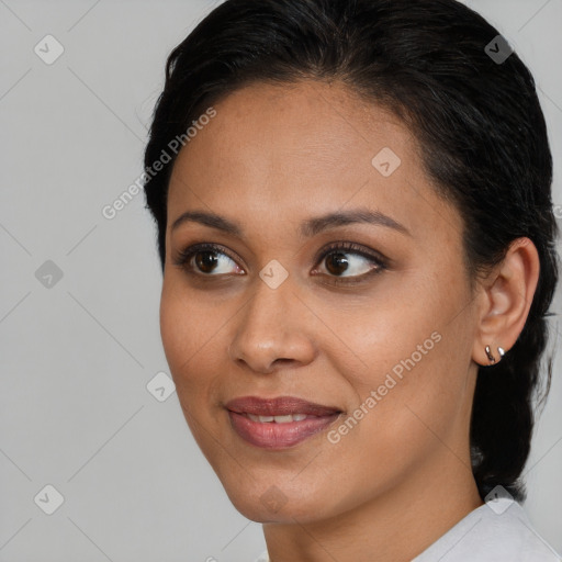 Joyful latino young-adult female with short  brown hair and brown eyes