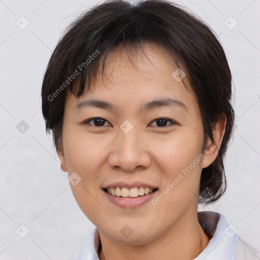 Joyful asian young-adult female with medium  brown hair and brown eyes