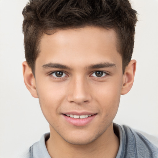 Joyful white child male with short  brown hair and brown eyes