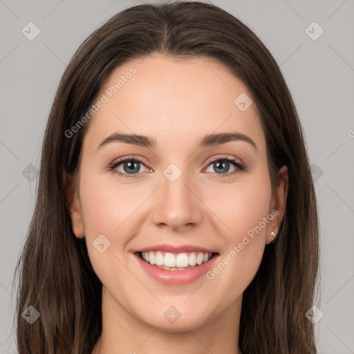 Joyful white young-adult female with long  brown hair and grey eyes