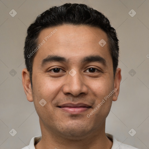 Joyful latino young-adult male with short  black hair and brown eyes