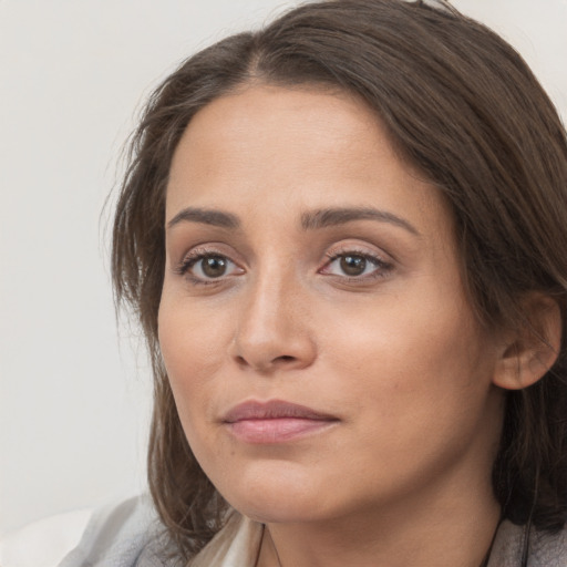 Neutral white young-adult female with medium  brown hair and brown eyes