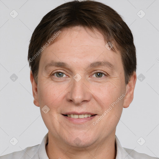 Joyful white adult male with short  brown hair and brown eyes