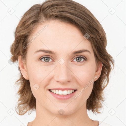 Joyful white young-adult female with medium  brown hair and green eyes