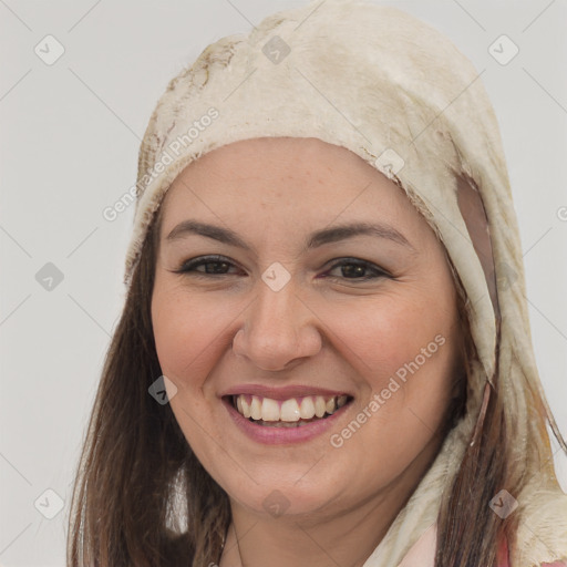 Joyful white young-adult female with long  brown hair and brown eyes