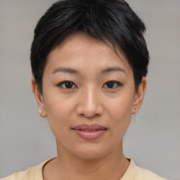 Joyful asian young-adult female with short  brown hair and brown eyes