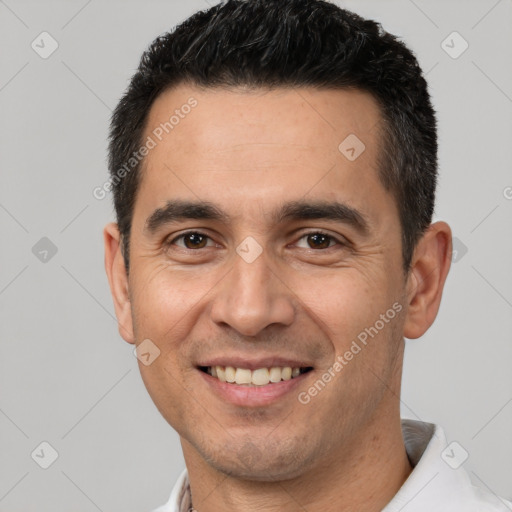 Joyful white young-adult male with short  black hair and brown eyes