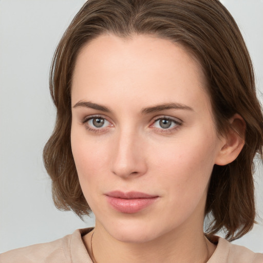 Neutral white young-adult female with medium  brown hair and grey eyes