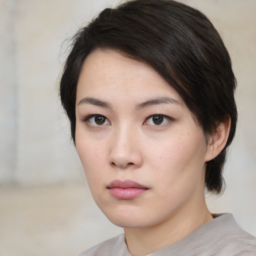 Neutral asian young-adult female with medium  brown hair and brown eyes