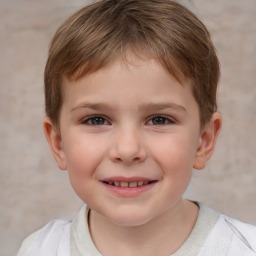 Joyful white child male with short  brown hair and brown eyes