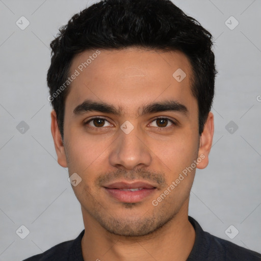 Joyful white young-adult male with short  black hair and brown eyes