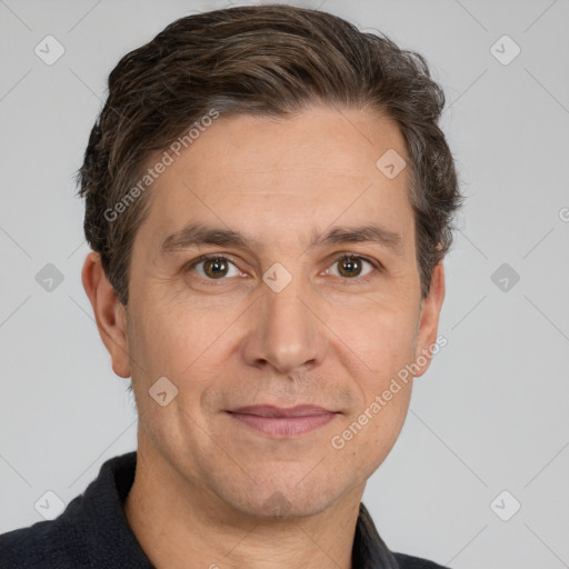 Joyful white adult male with short  brown hair and brown eyes