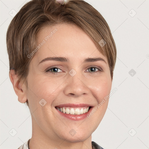 Joyful white young-adult female with short  brown hair and grey eyes