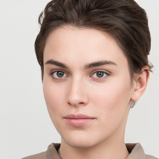 Neutral white young-adult female with short  brown hair and brown eyes