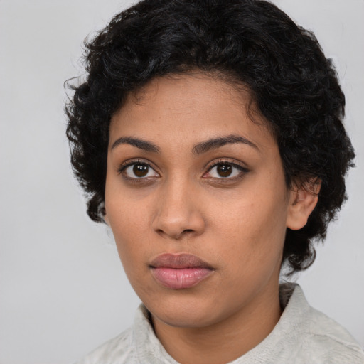 Neutral latino young-adult female with medium  brown hair and brown eyes